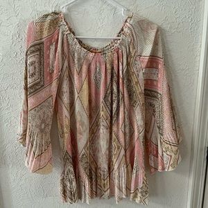 Pink multi print blouse with winged arms.